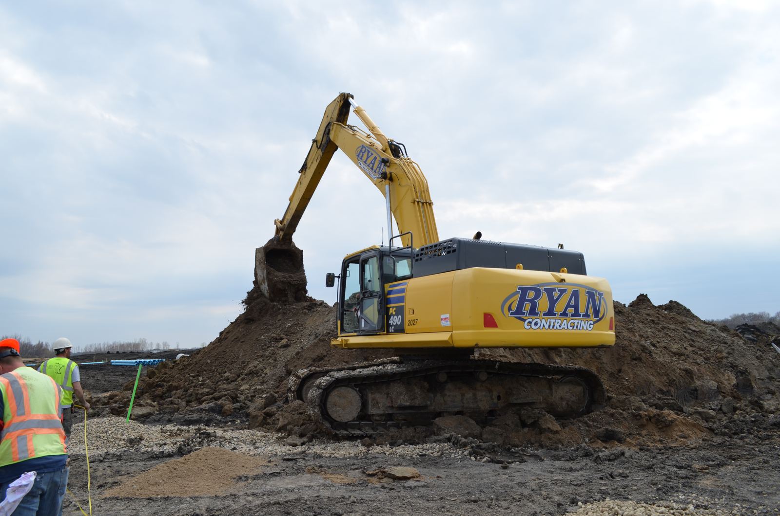 Ryan Contracting Komatsu PC490 excavator working a stockpile