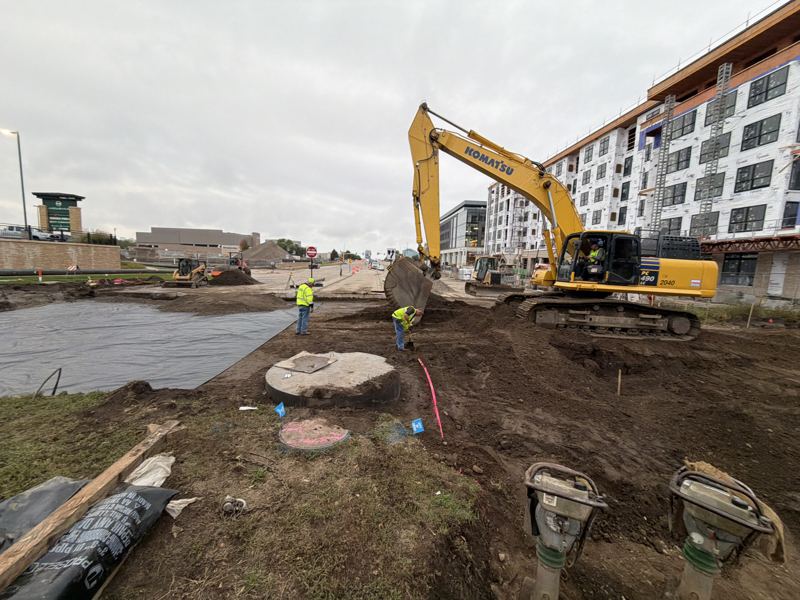 Excavation and structures beside new apartment construction
